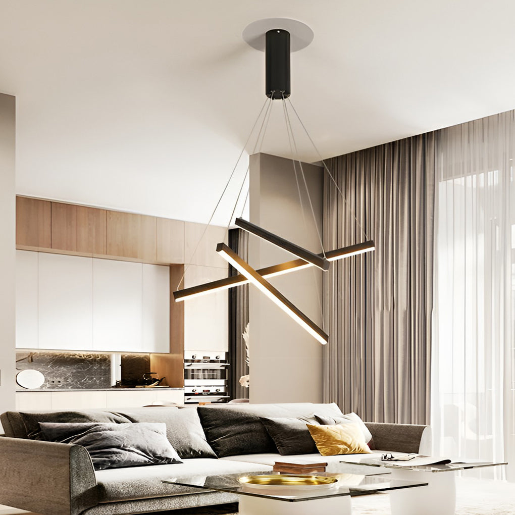 Modern Criss linear chandelier with gold and black finish, suspended above a stylish dining table.
