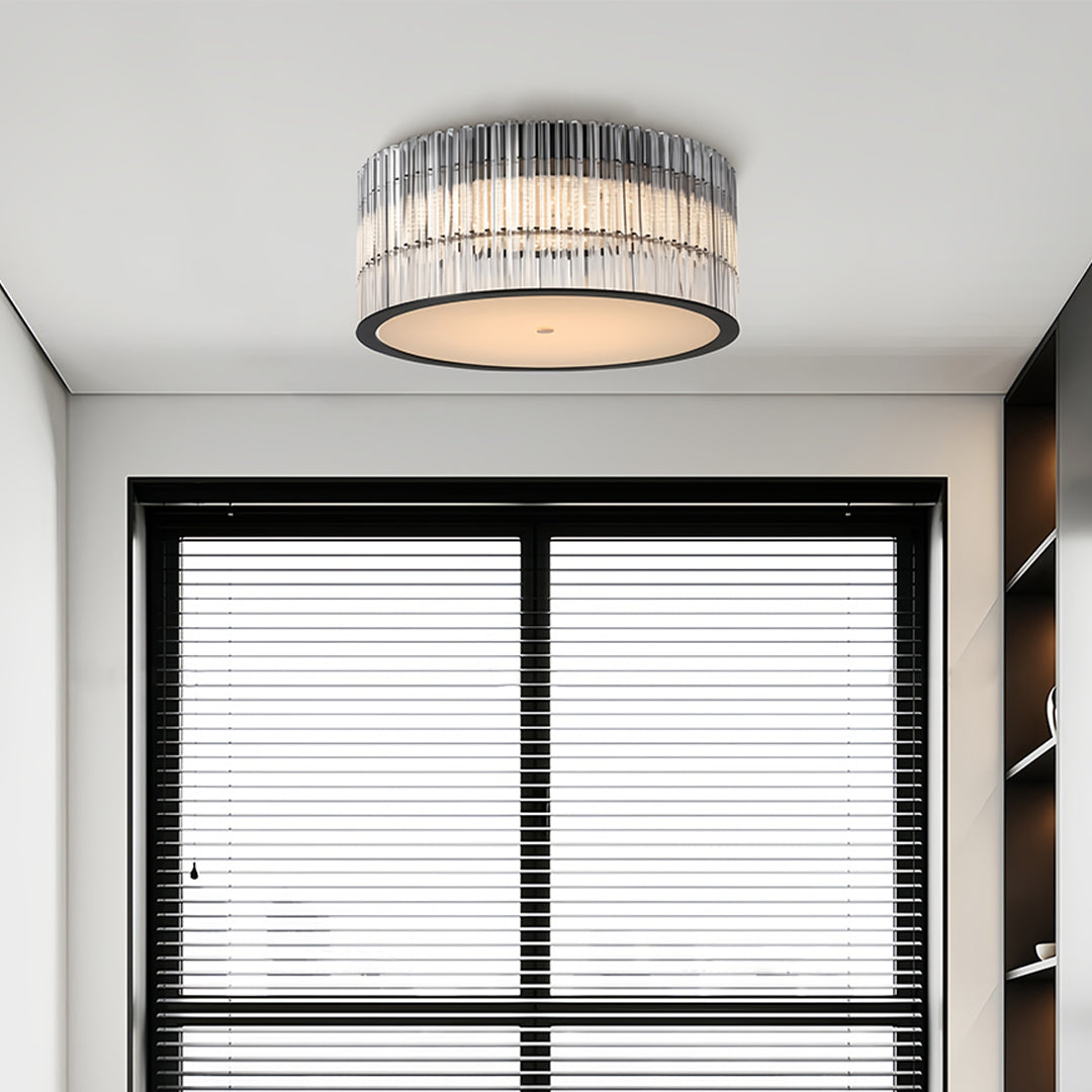 Modern crystal flush mount ceiling lights with a sleek circular design, installed in a living room with large windows.
