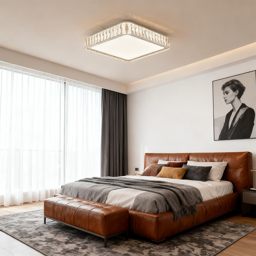 Modern crystal flush mount lighting fixture illuminating a cozy bedroom with warm soft lighting.