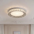 Stunning modern crystal flush mount lighting with a silver crystal ring and a textured center.