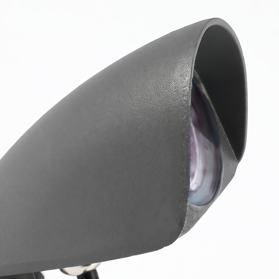 Modern decorative wall wash lighting with metallic finish and curved shield.