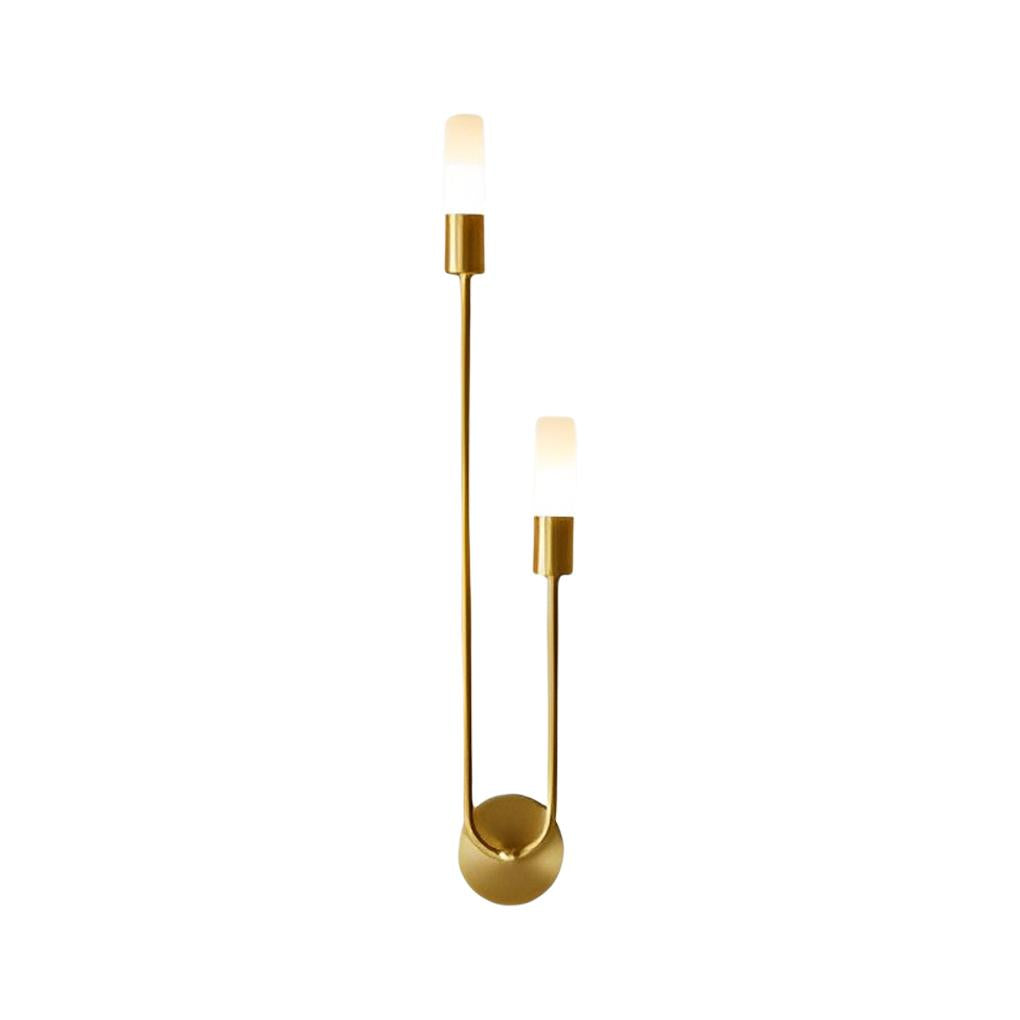 Modern double heads wall sconce with a sleek design, illuminating a contemporary dining area.