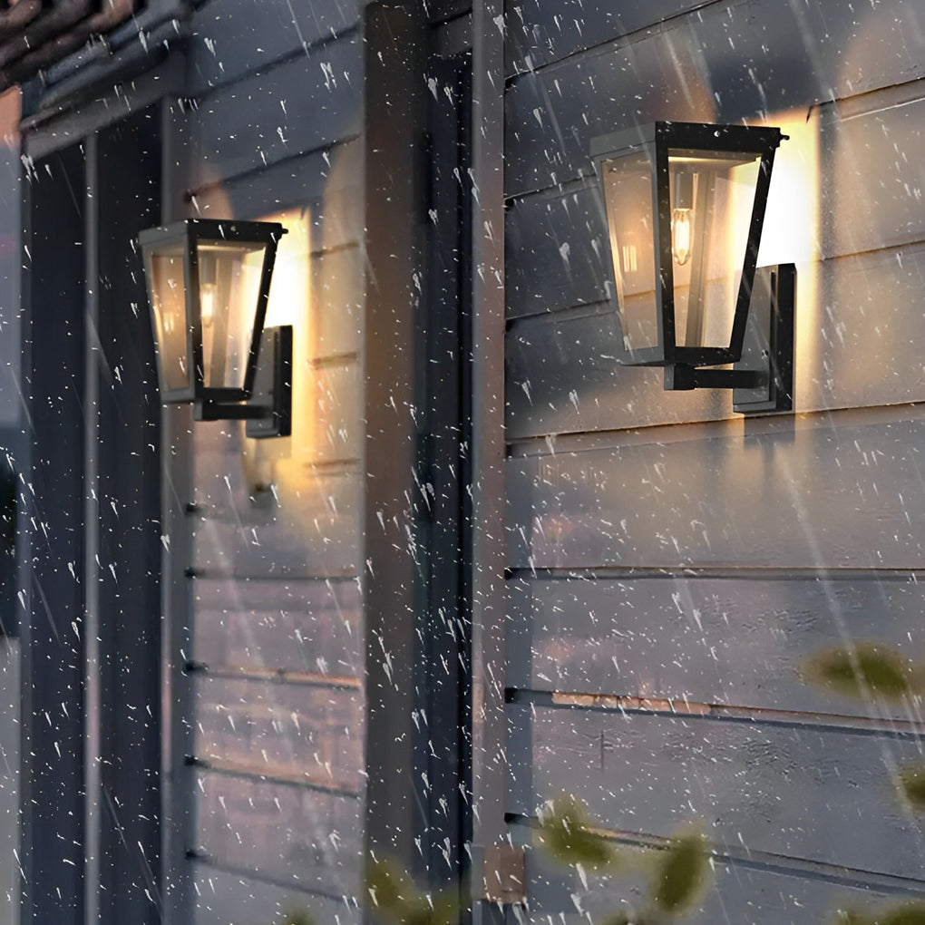 Modern exterior LED wall lantern illuminating a minimalist building corner and glass window at night.