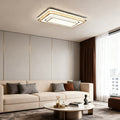 Modern flush mount light fixture illuminating a bright living room with minimalist design.