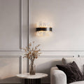 Modern luxury chandeliers enhancing minimalist living room with grey sofa and marble table