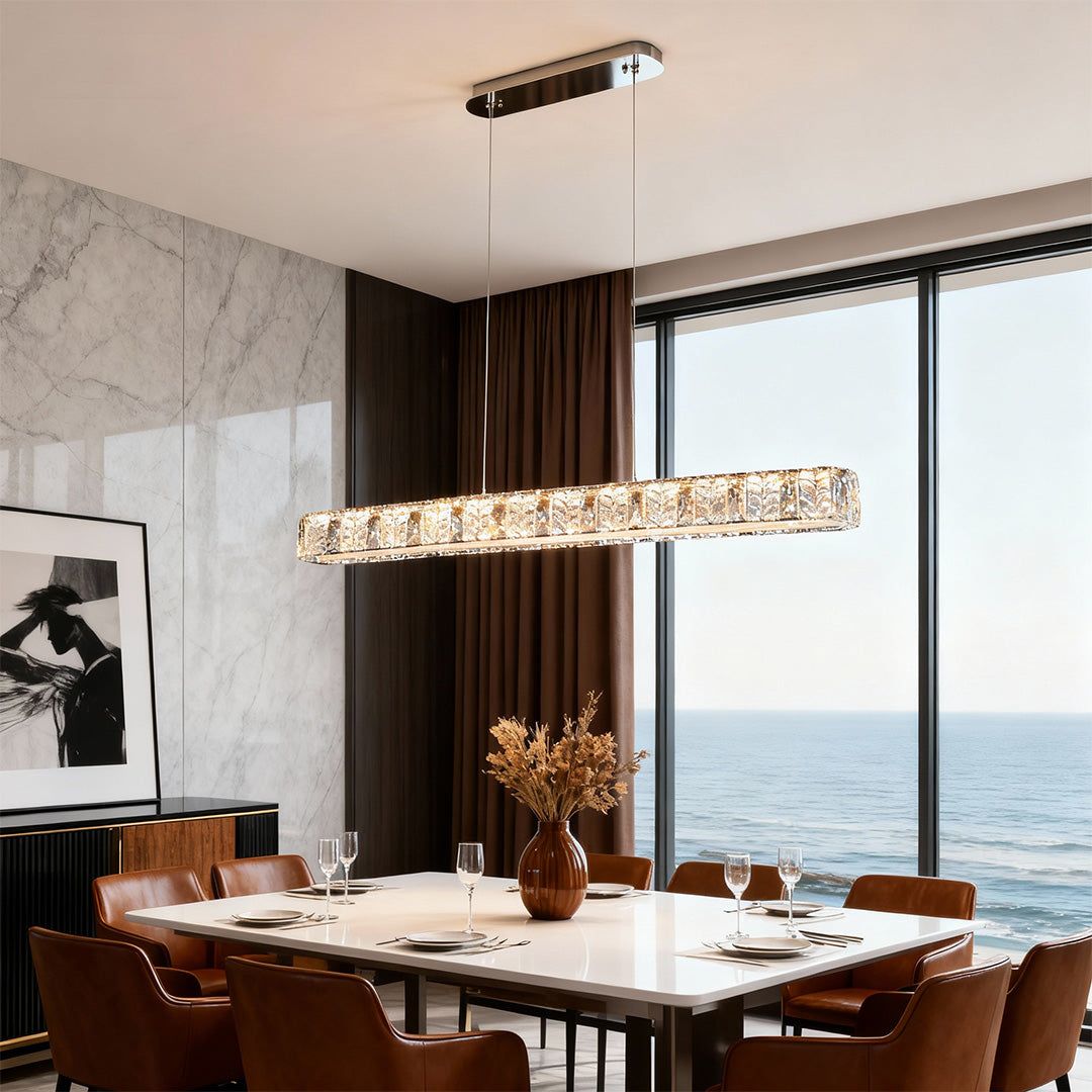 Modern gold pendant light with a rectangular crystal design, perfect for contemporary dining rooms.