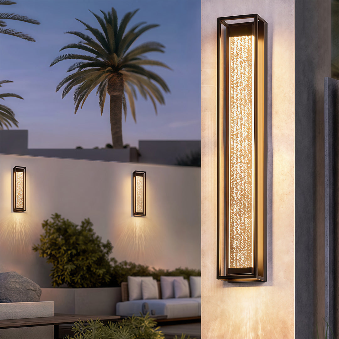 Outdoor sconces black with a textured glass front, enhancing the exterior of a modern home.
