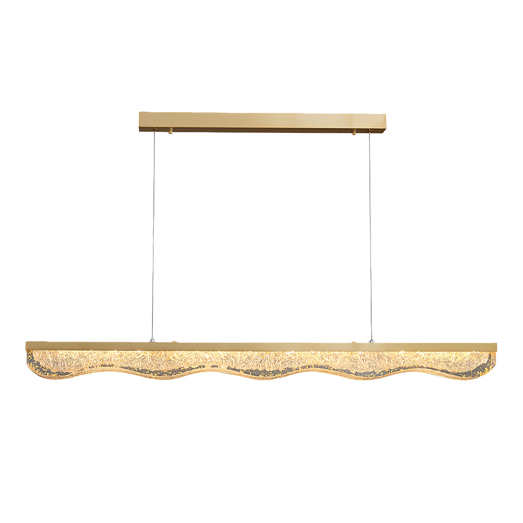 Modern large gold pendant light featuring elongated rectangular design with rippled glass and gold canopy.
