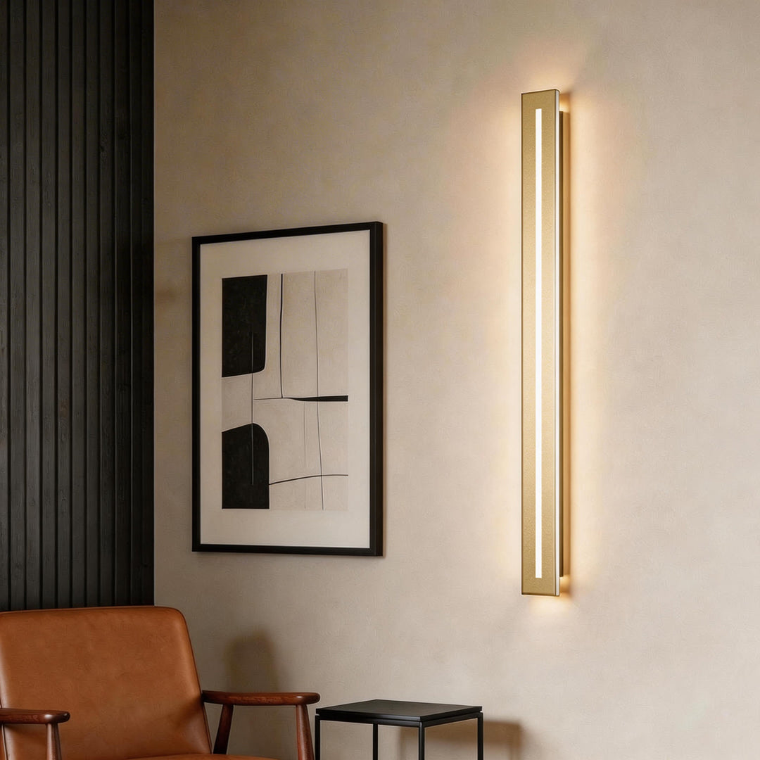 Modern minimalist gold and long black wall sconces for living room decor.
