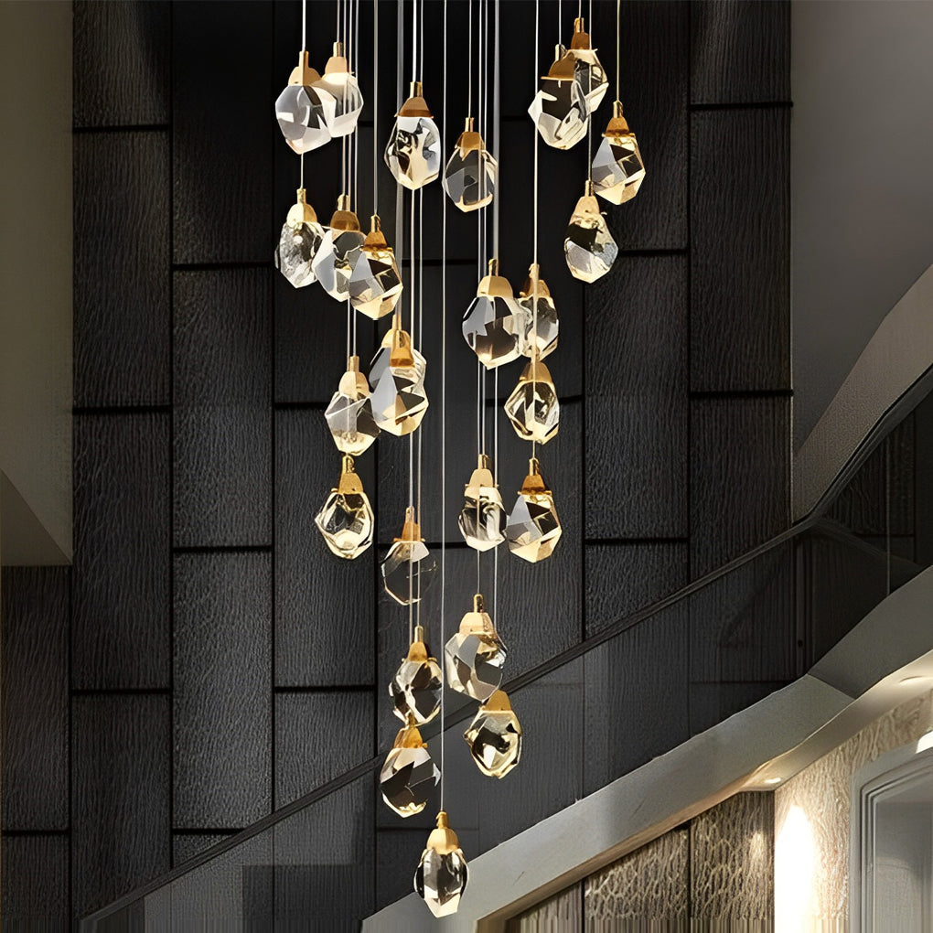 Modern luxury staircase chandelier hanging along a curved staircase, adding opulence to the space.