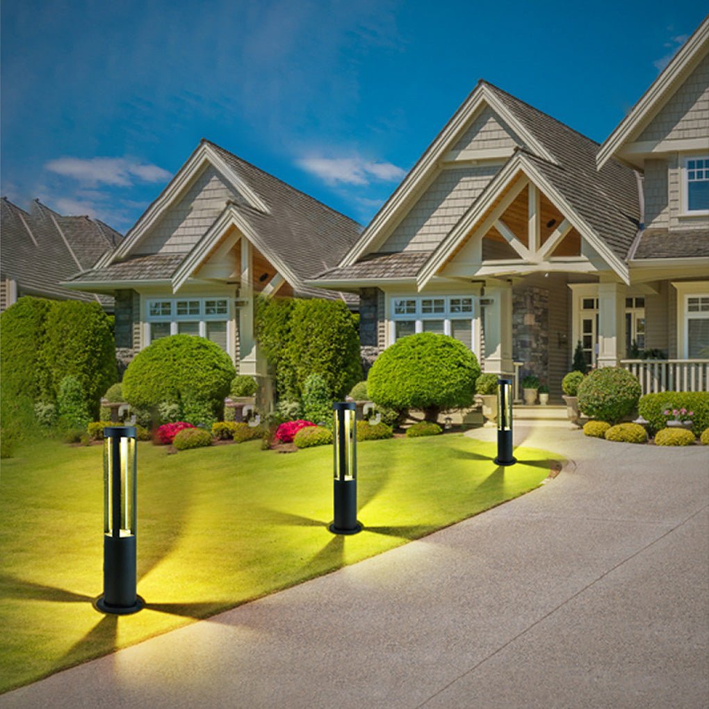 Modern outdoor bollard lights enhancing a contemporary garden with a minimalist design.