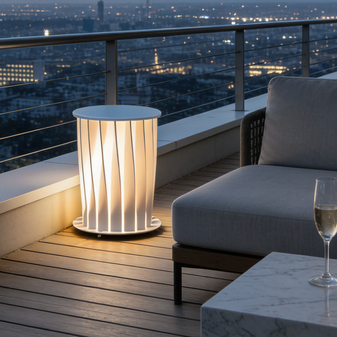 Modern outdoor lanterns installed along wooden deck edge creating warm lighting effect.