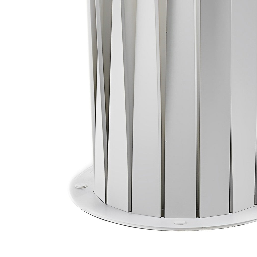 Close up detail of modern outdoor lanterns showing vertical metal fins and light diffusion.