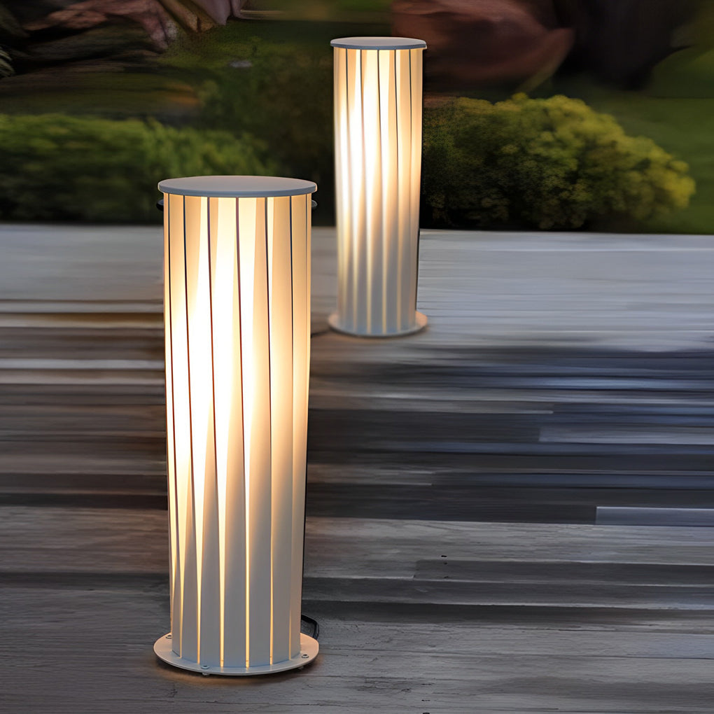 Modern outdoor lanterns arranged on outdoor wooden deck creating balanced ambient lighting.
