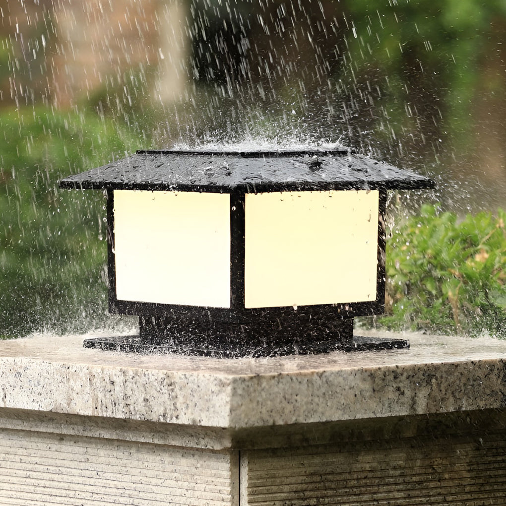Modern outdoor pillar light with a double-sided design, installed on a stone wall for enhanced outdoor illumination.