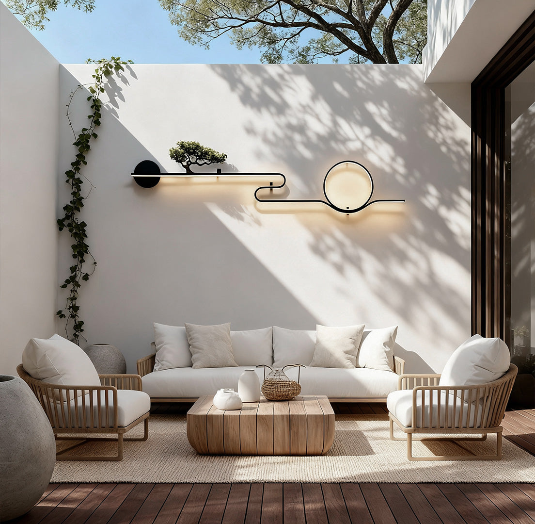 Modern outdoor wall lights with circular LED design mounted on a concrete garden outdoor wall daytime.