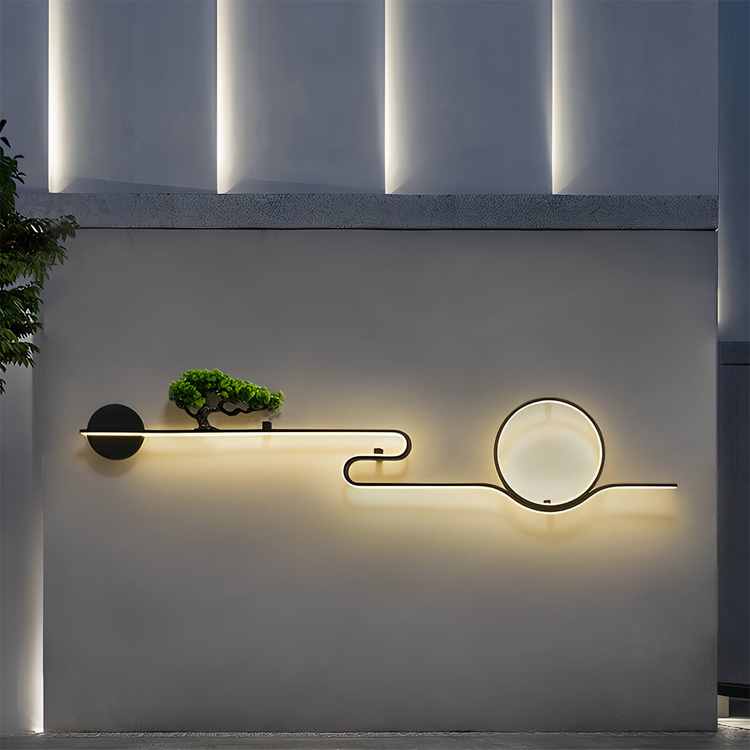 Modern outdoor wall lights creating soft ambient lighting on a textured exterior facade.
