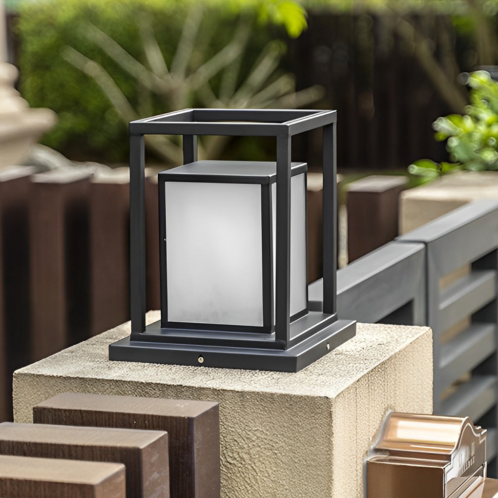 Modern outdoor wall pillar lights with square frame design placed on concrete post outdoors.
