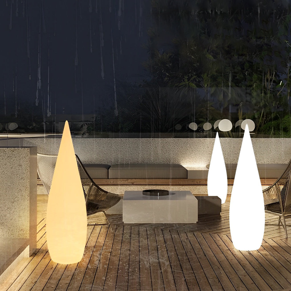 Modern teardrop outdoor light illuminating garden pathway with soft ambient glow.