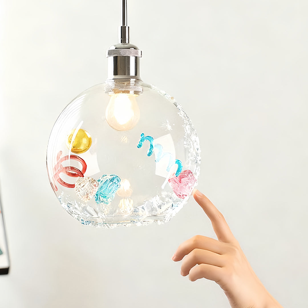 Modern colorful glass pendant lights showcasing vibrant swirls and a clear globe design for the dining room.