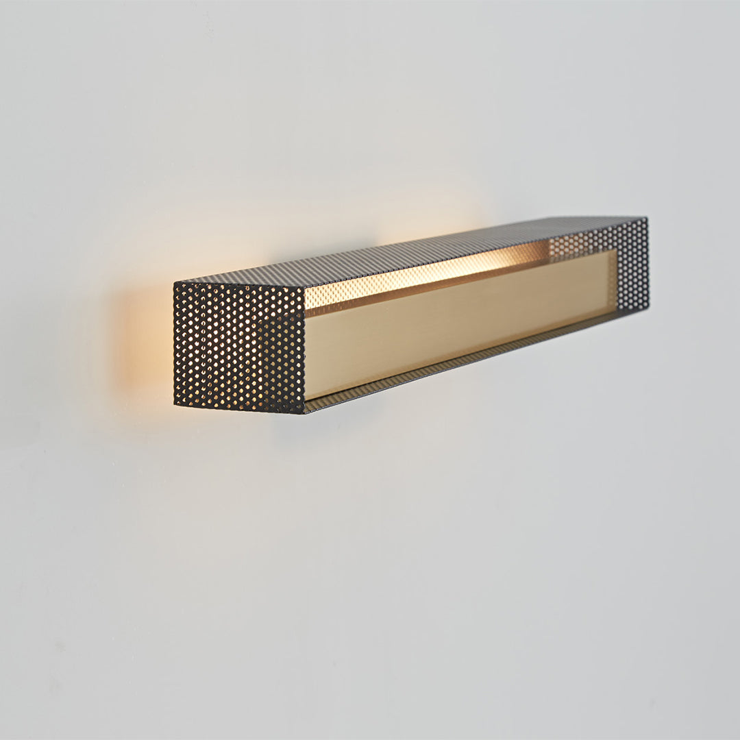 Modern wall picture lights with perforated pattern side view, soft wall illumination.