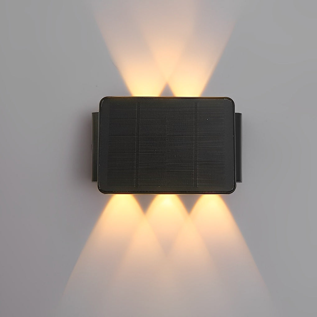 Wall sconce up and down light with modern design on gray wall.