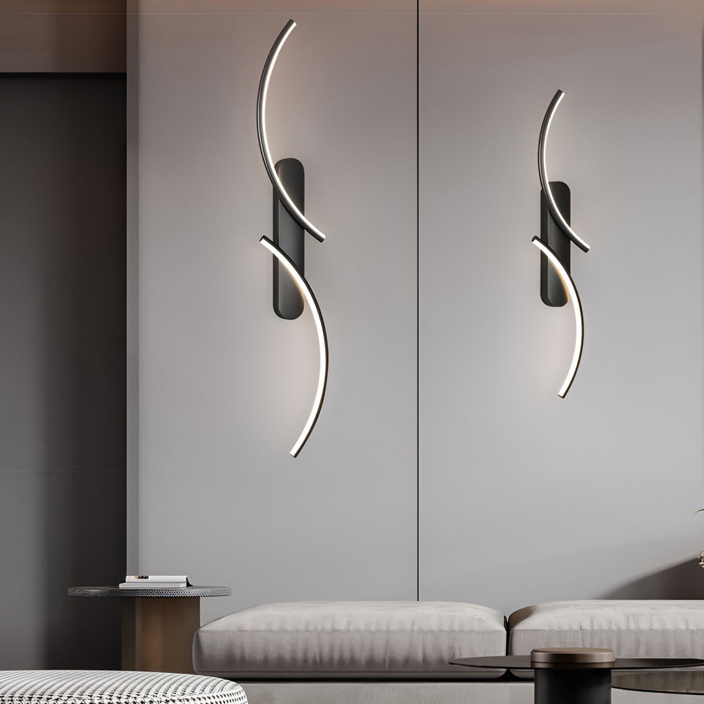 Modern wave wall sconce enhancing a contemporary bedroom with sleek design.