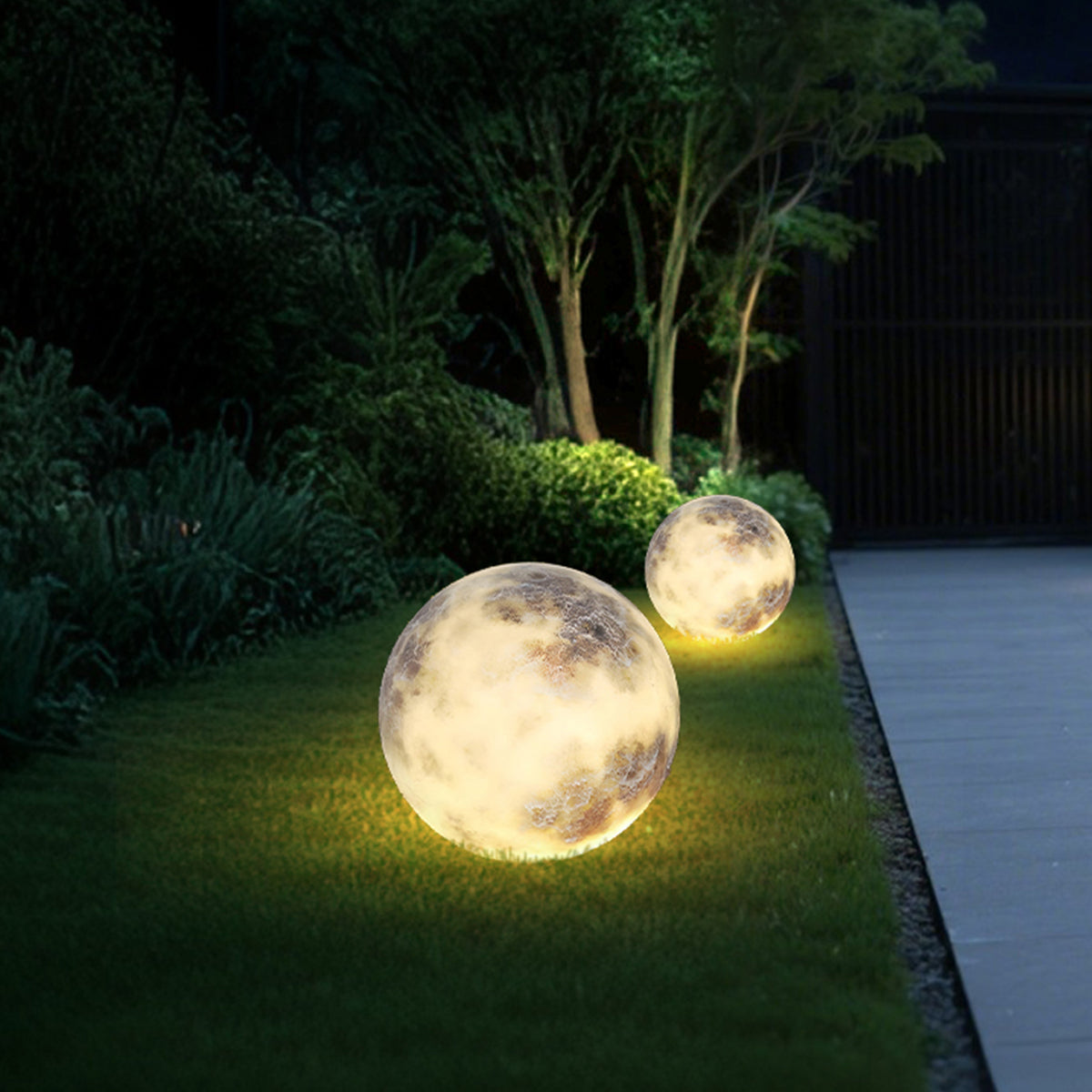 Moon light spheres used as accent lighting on a lawn.
