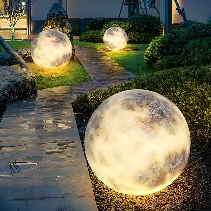 Moon light illuminating an outdoor garden pathway at night.