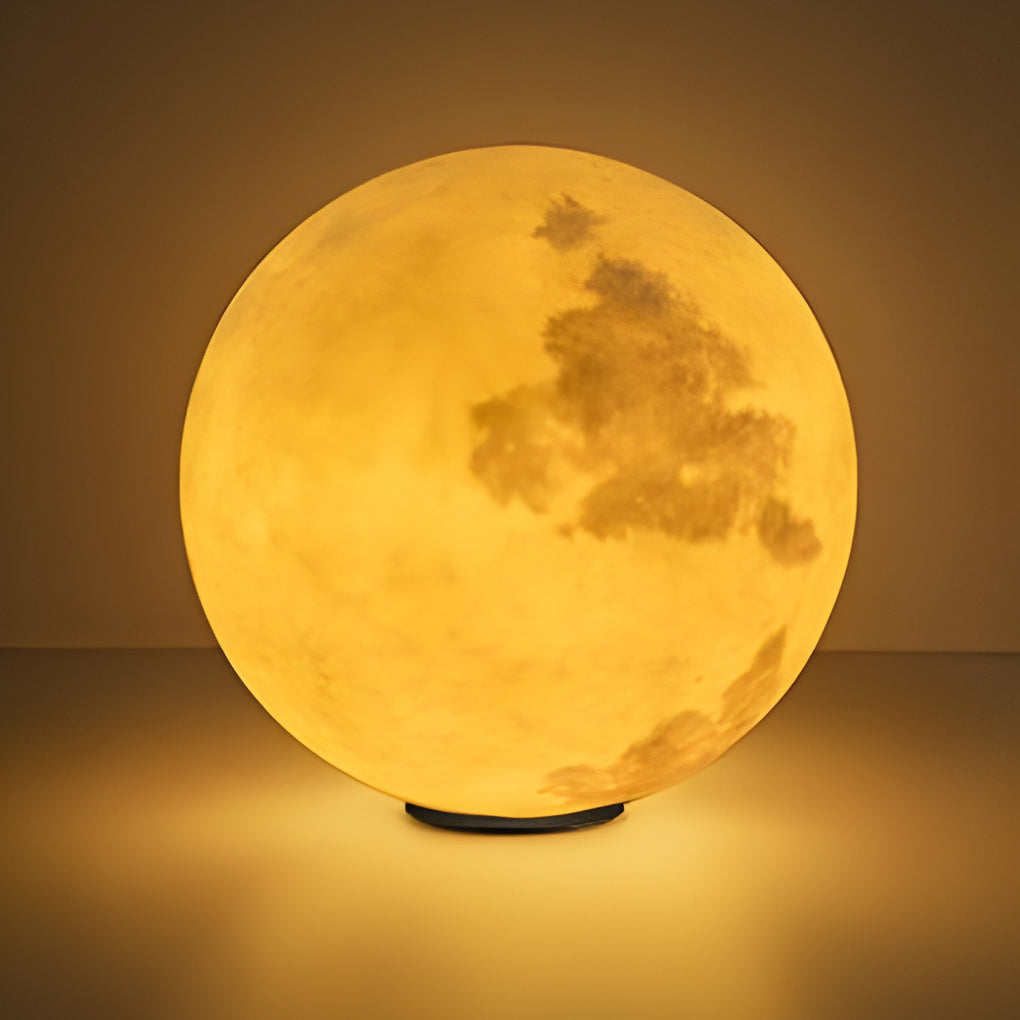Moon pillar lights with moon surface, providing soft light on outdoor terrace.