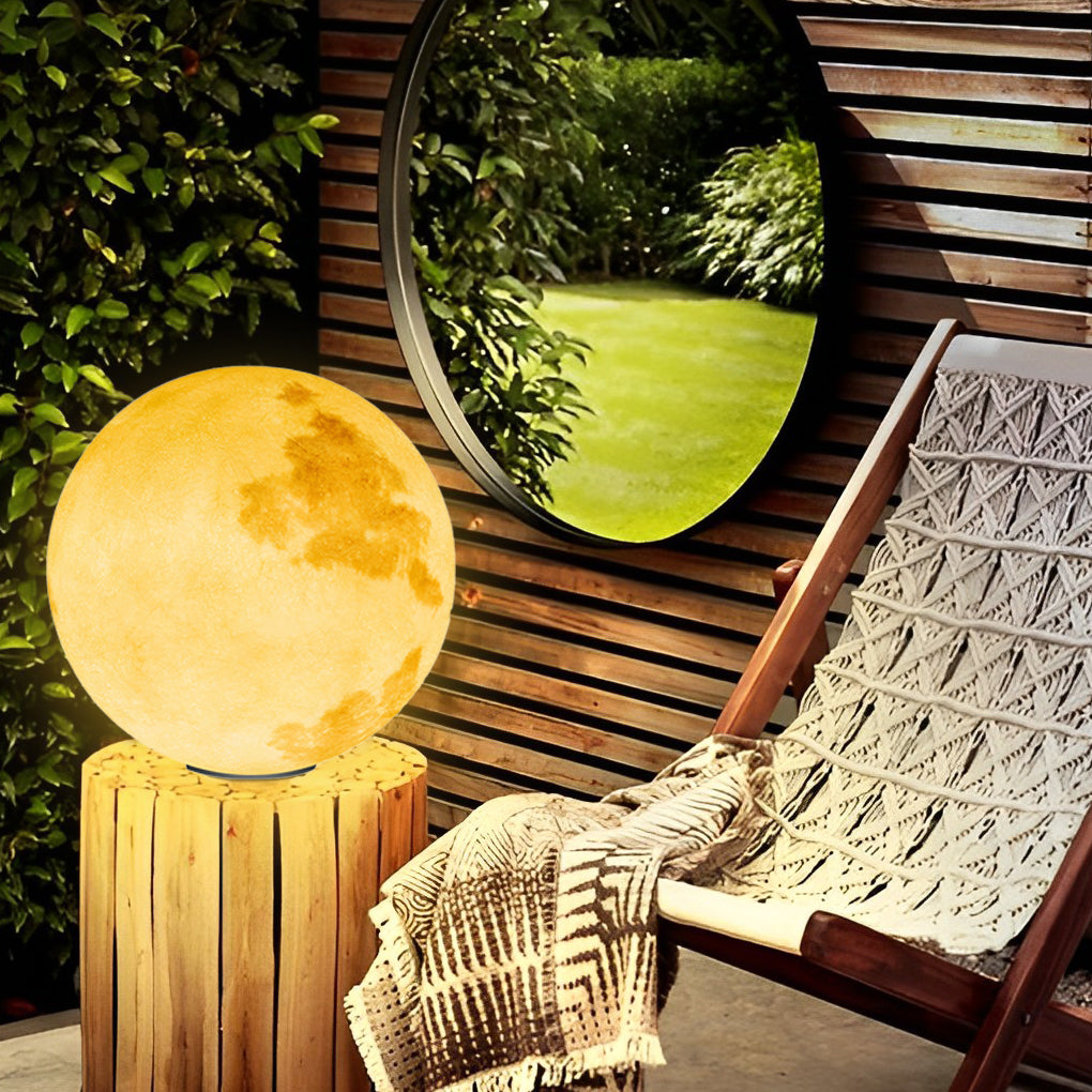 Moon-shaped stone pillar light with realistic moon surface texture in garden.