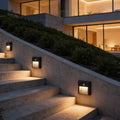 Motion sensor LED step lights illuminating modern outdoor stairs with warm light.
