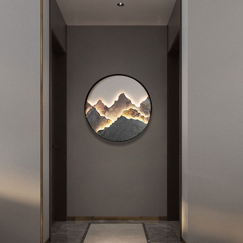 Mountain LED wall light mounted on a dark corridor wall