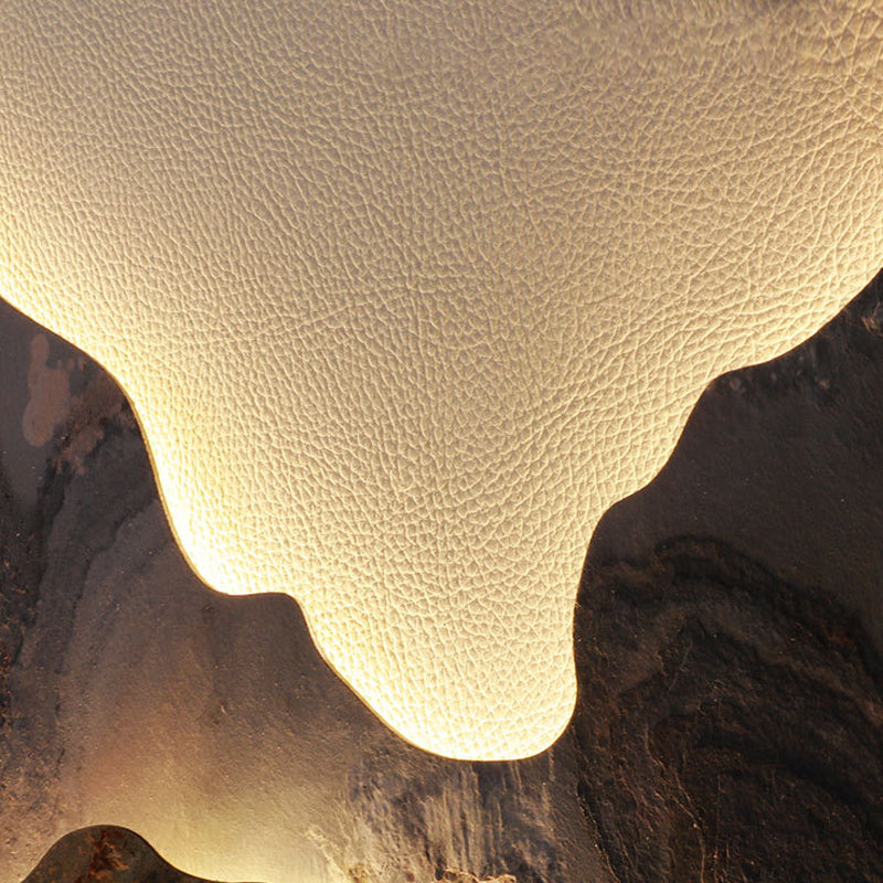 Mountain LED wall light close-up showing warm LED glow behind mountains
