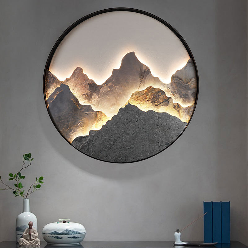 Round mountain LED wall light showing layered mountain landscape design