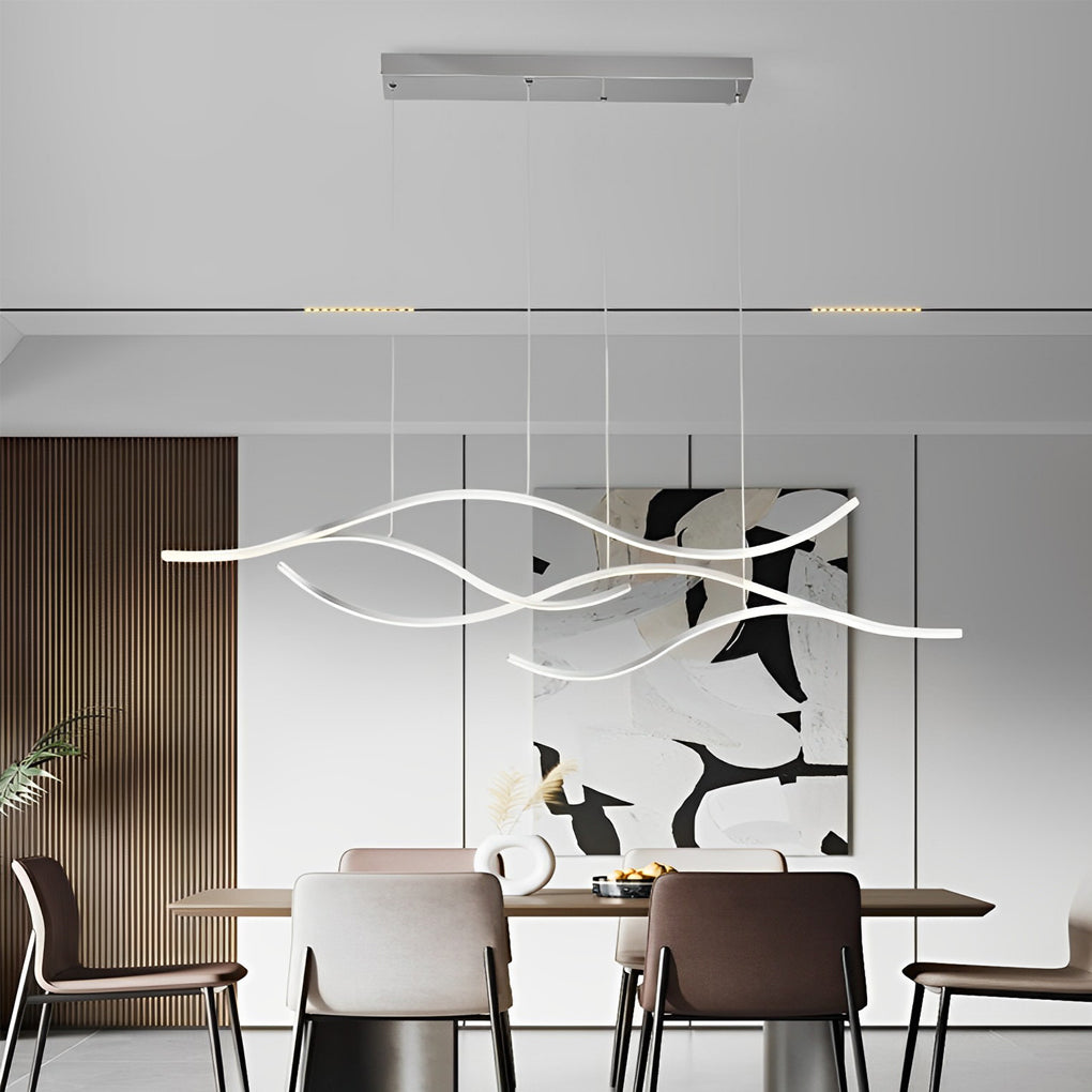 Curved LED pendant light with multiple wave elements in a modern open-plan space.