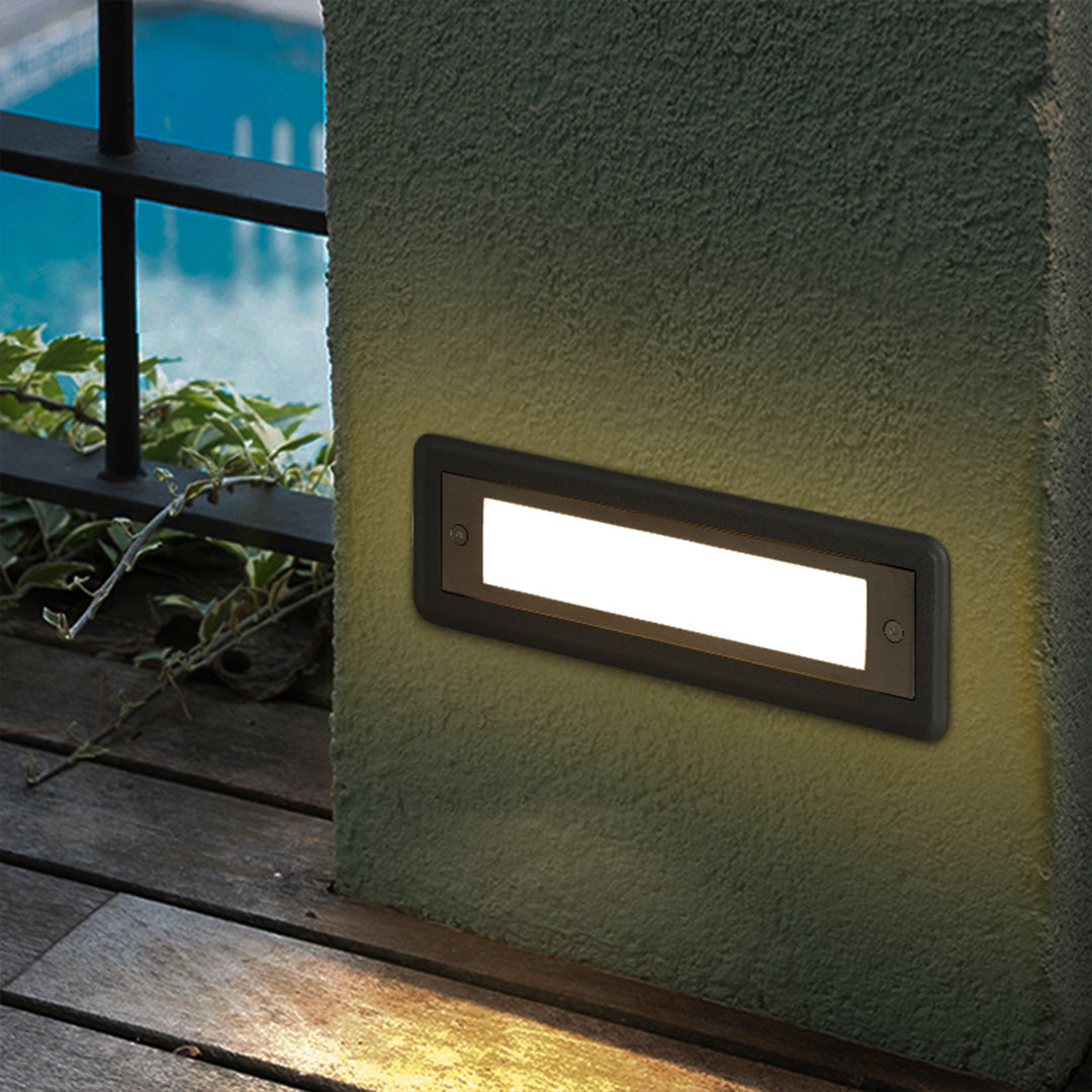 Multiple LED step lights installed along modern building exterior providing safe navigation lighting