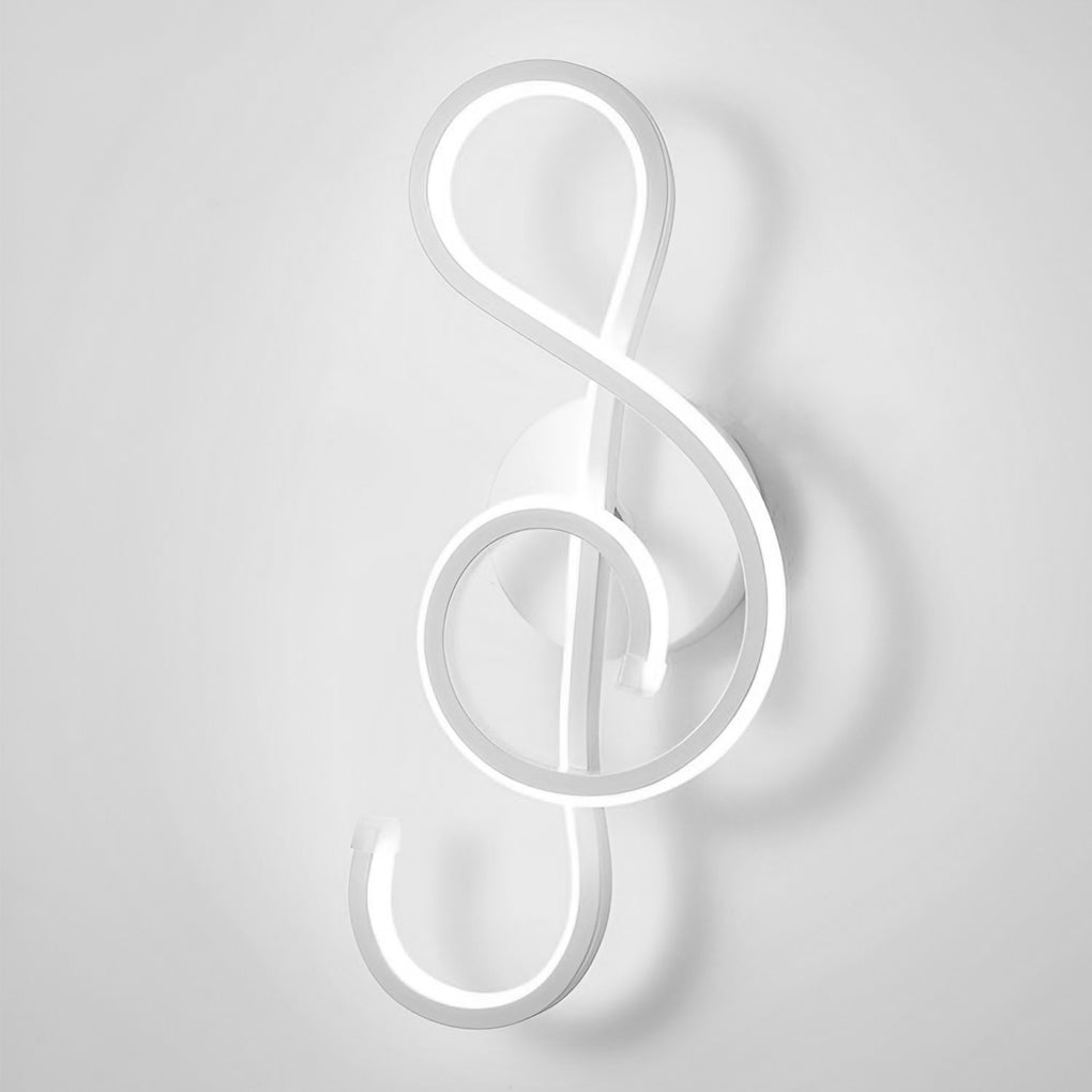 Musical note wall light with a close up of the treble clef light fixture.