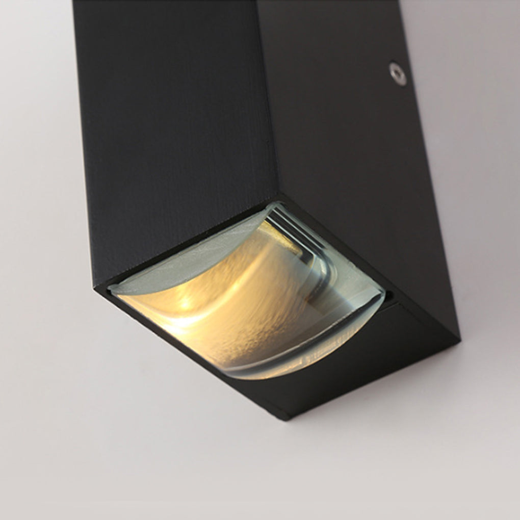 Close-up detail of the lens and housing of a narrow beam wall sconce, highlighting precision light control.