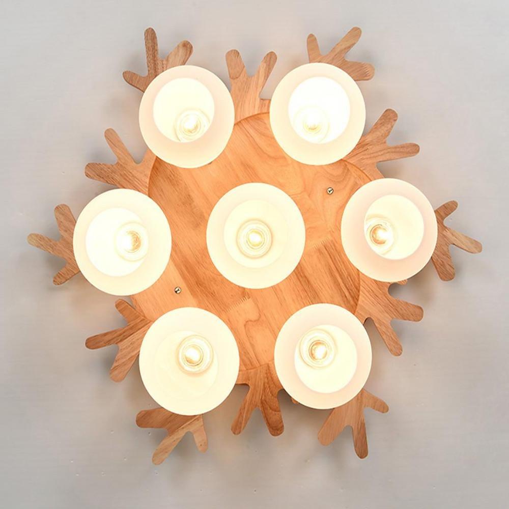 Modern natural wood globe ceiling lamp isolated on white background with multiple spherical glass shades.