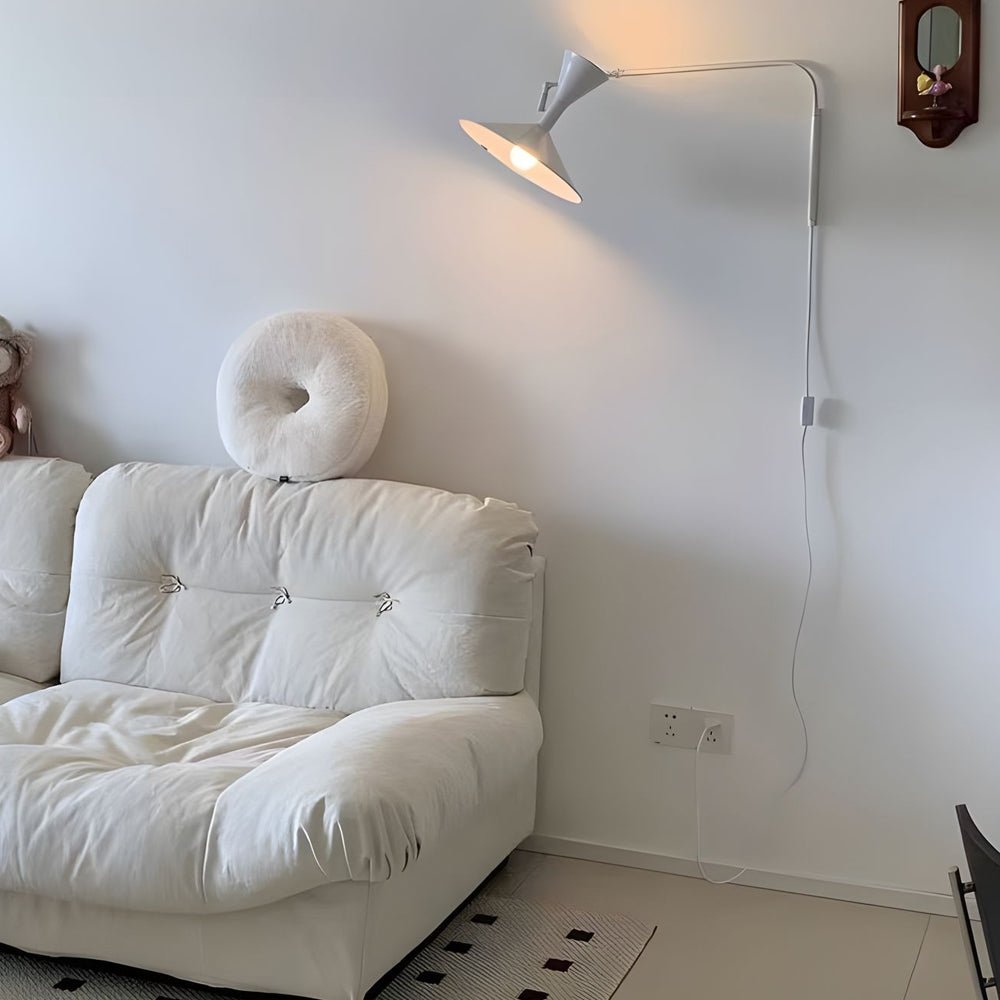 Stylish swing arm wall sconce in a neutral tone, offering adjustable lighting for versatile room settings.