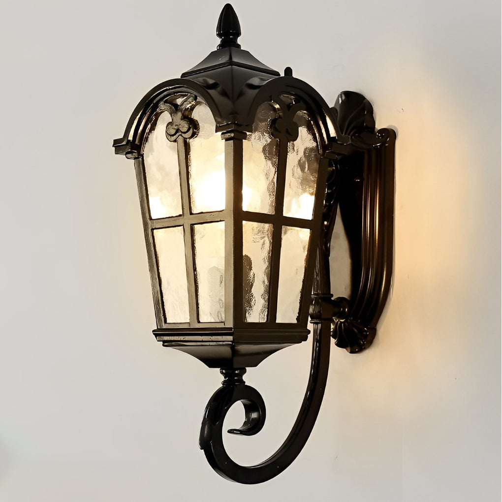 Outdoor black sconce providing focused light on a white exterior wall.