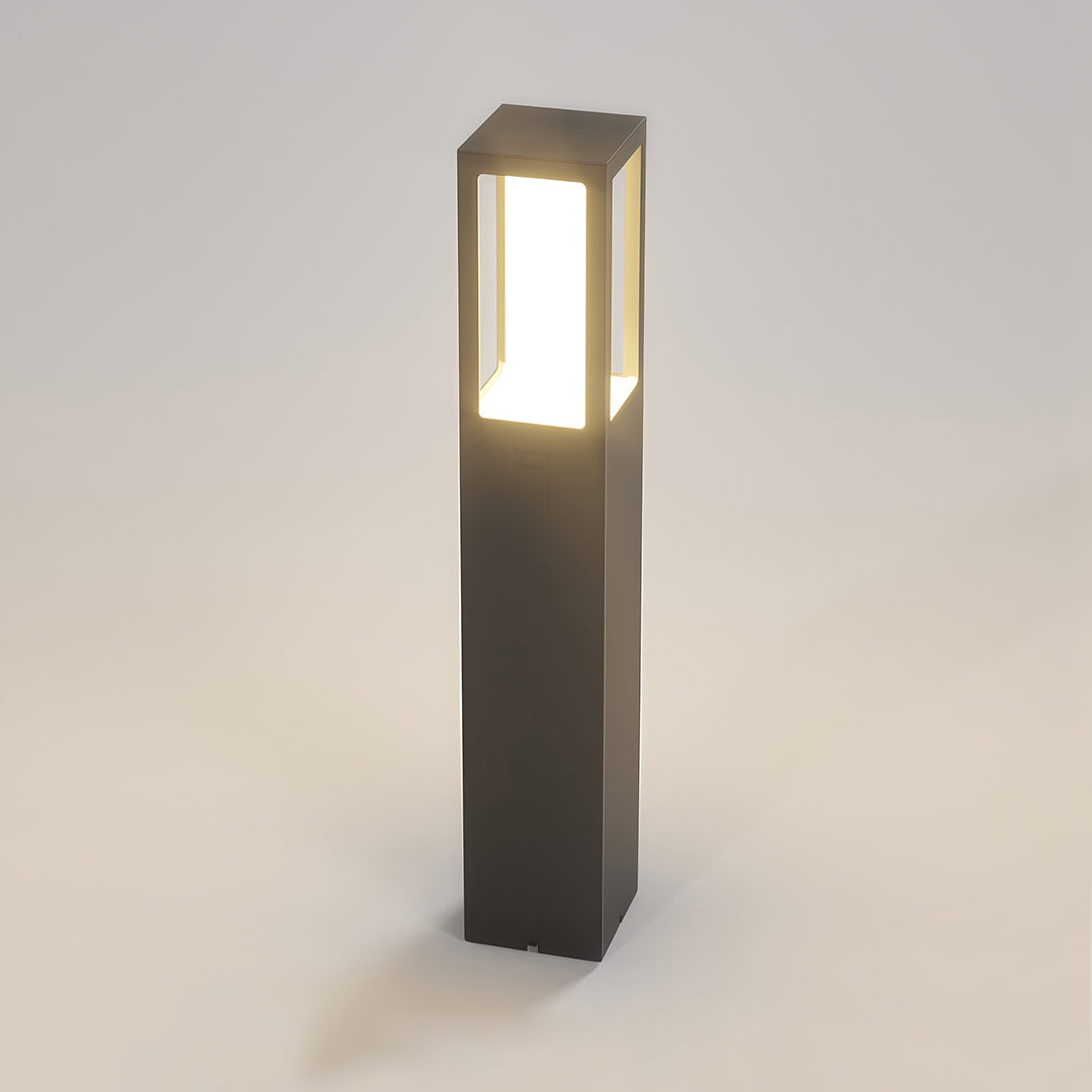 Outdoor bollard light featuring a minimalist black rectangular design and a soft light glow.