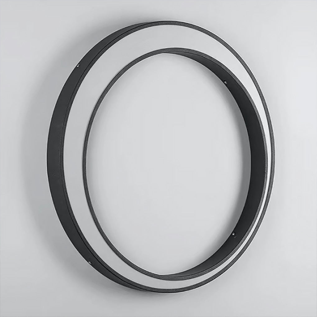 Outdoor cylinder wall light integrated into a minimalist exterior passage, creating a refined and modern lighting accent.