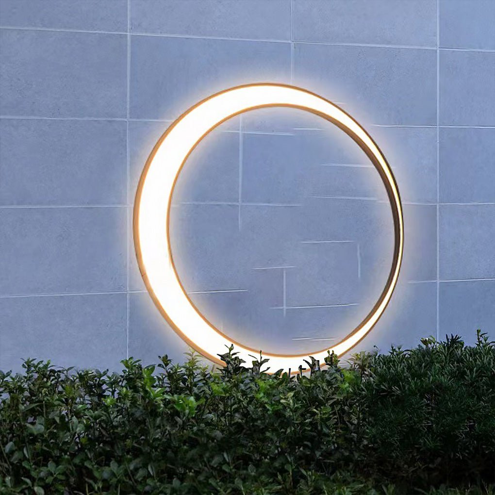 Outdoor cylinder wall light mounted on a tiled exterior wall, delivering a clean circular glow for modern outdoor decor.