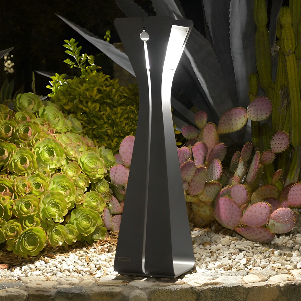 Sculptural outdoor floor lamps for porches set among plants, offering decorative accent lighting in a landscaped area.