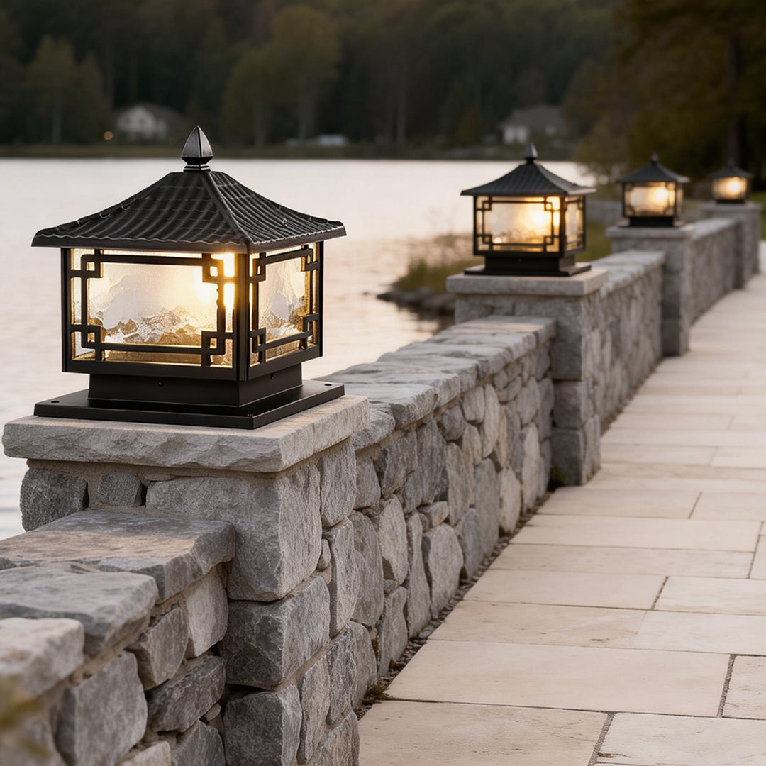 Outdoor garden pillar lights with a black metal frame, adding a modern touch to garden decor.