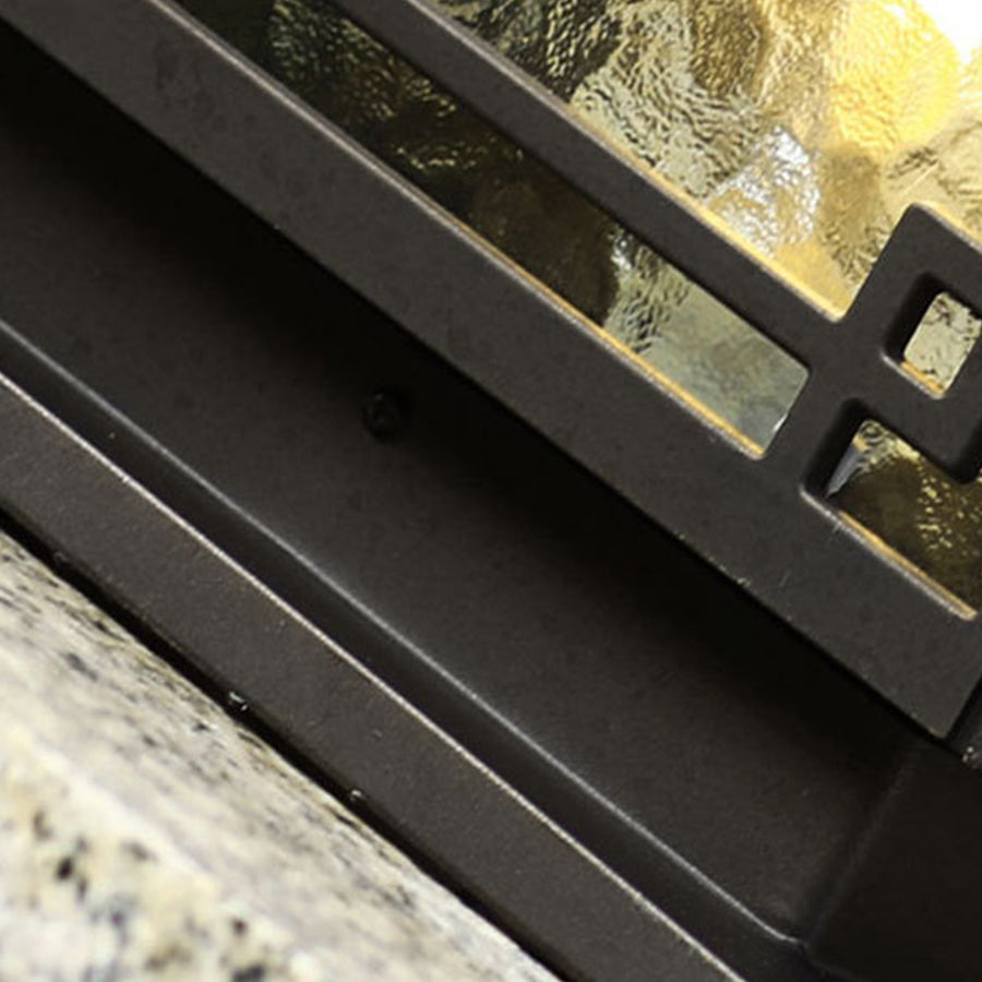 Outdoor garden pillar lights with a detailed view of glass panels, showcasing elegant craftsmanship.