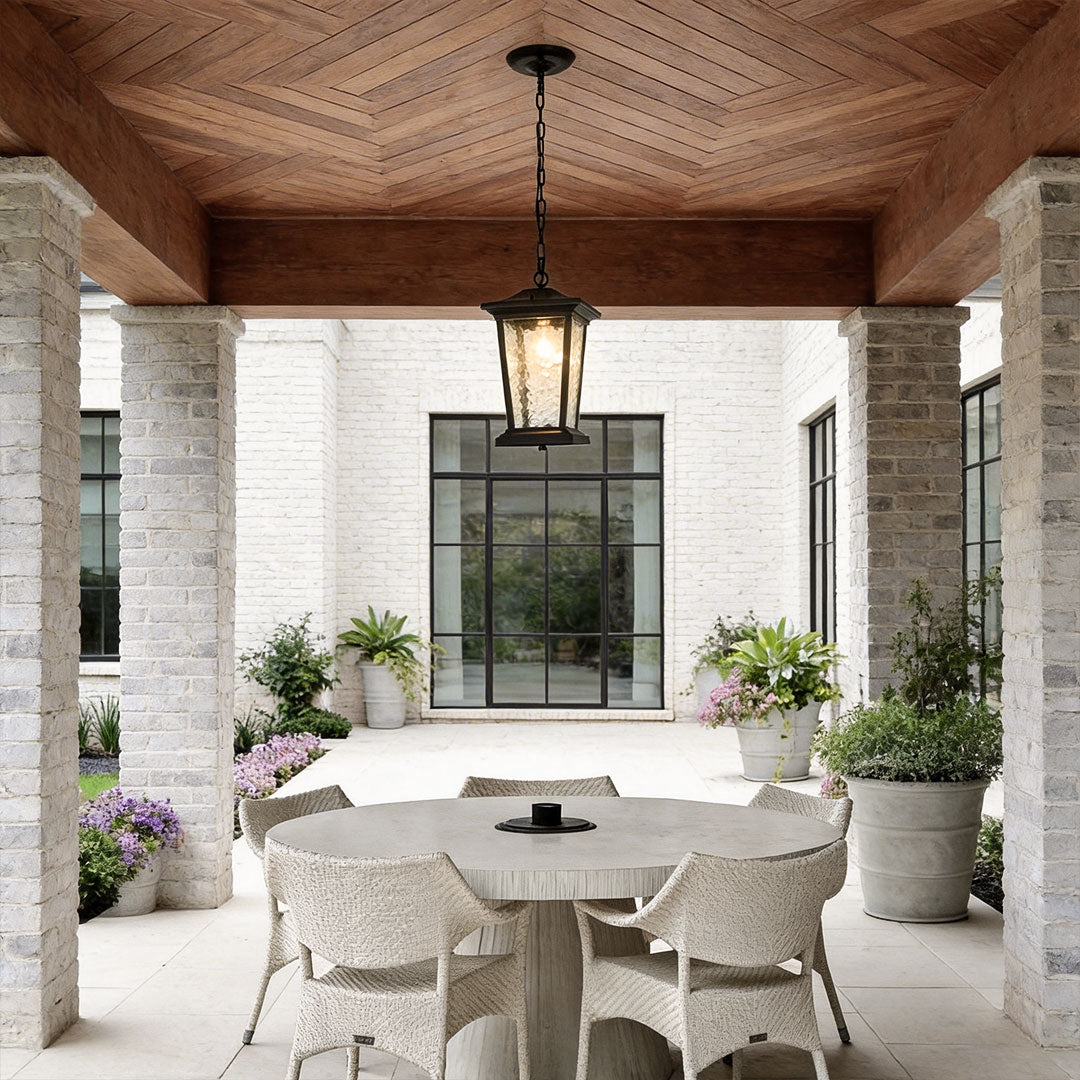 Outdoor hanging lights for porch with a vintage design, illuminating a modern house entrance.