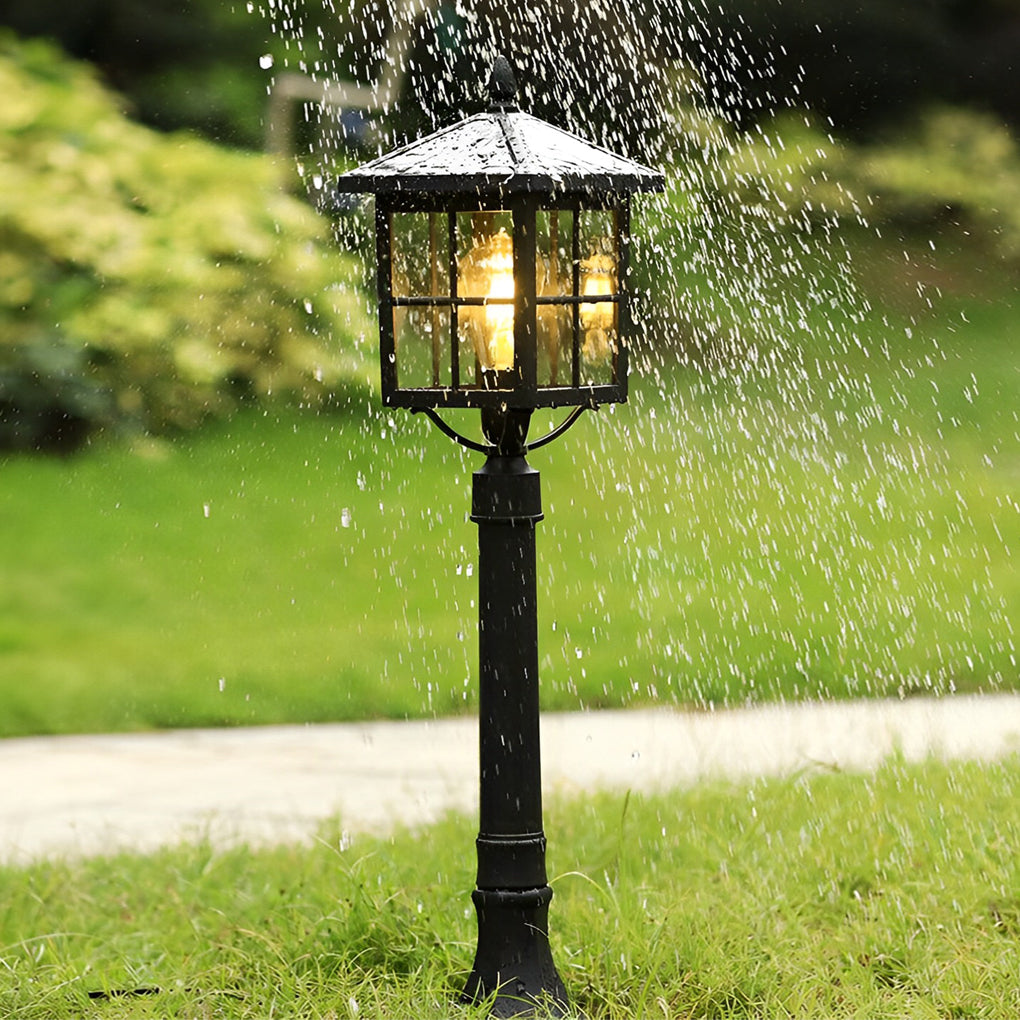Outdoor lawn lights providing ambient lighting in a lush garden during the evening.